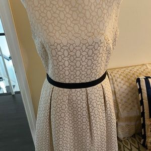 Exquisite dress with gold design mimics a belt… very complementary to any figure